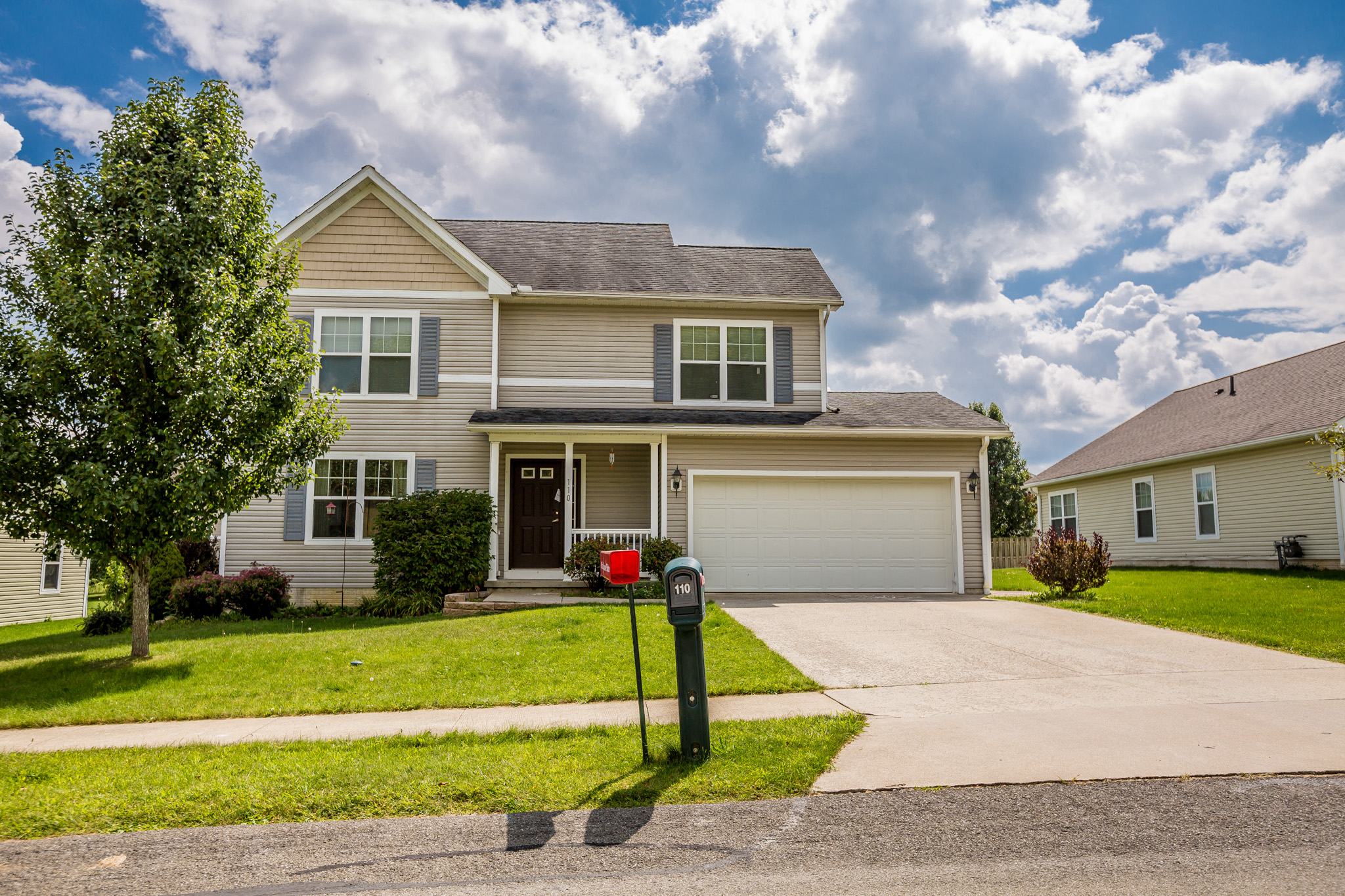 a house with a parking meter in front of it